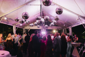 Rooftop celebration at an outdoor wedding venue with panoramic Nashville views