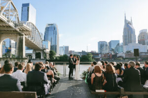Outdoor wedding ceremony on the Riverfront Terrace at The Bridge Building in Nashville