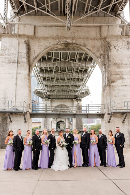 Bride and Groom with Wedding Party under the Bridge in Nashville {{brizy_dc_image_alt imageSrc=