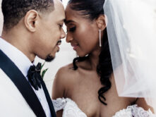 A bride and groom touch foreheads for glamorous wedding portrait {{brizy_dc_image_alt entityId=
