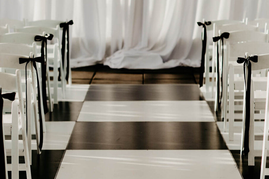 Haley and Andrew's black and White Timeless Wedding Ceremony Setup {{brizy_dc_image_alt imageSrc=