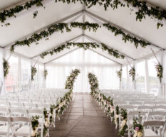 Ceremony Setup on the rooftop with greenery installs and purple roses