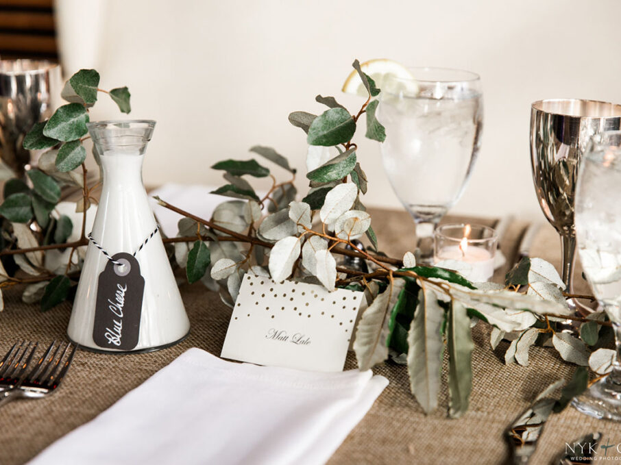 Dried greenery runner on burlap table linens for nautical themed rehearsal dinner